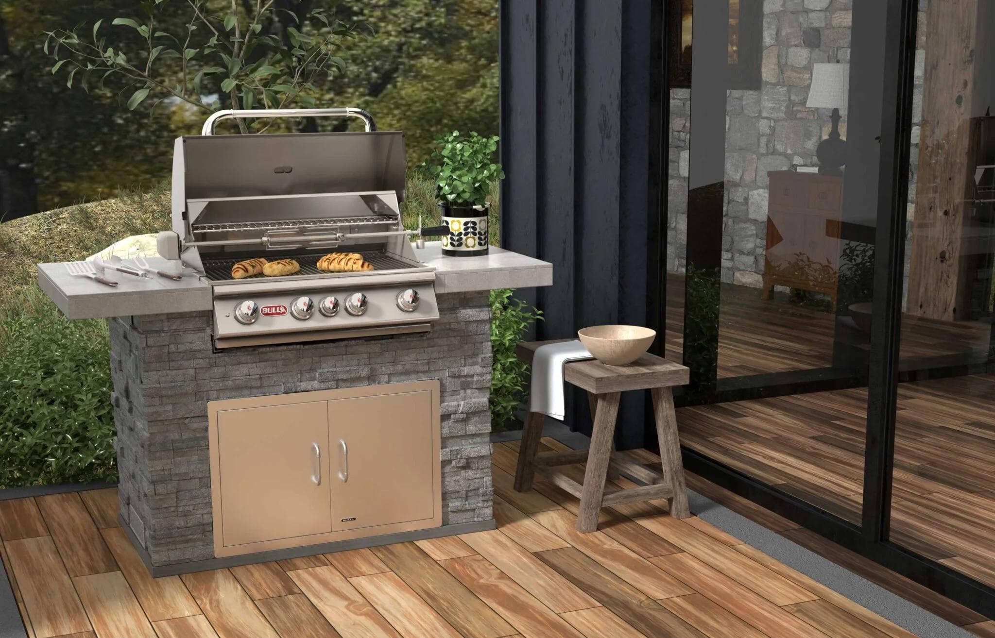 Bull Master Q outdoor kitchen island with built-in Angus grill in a backyard setting.