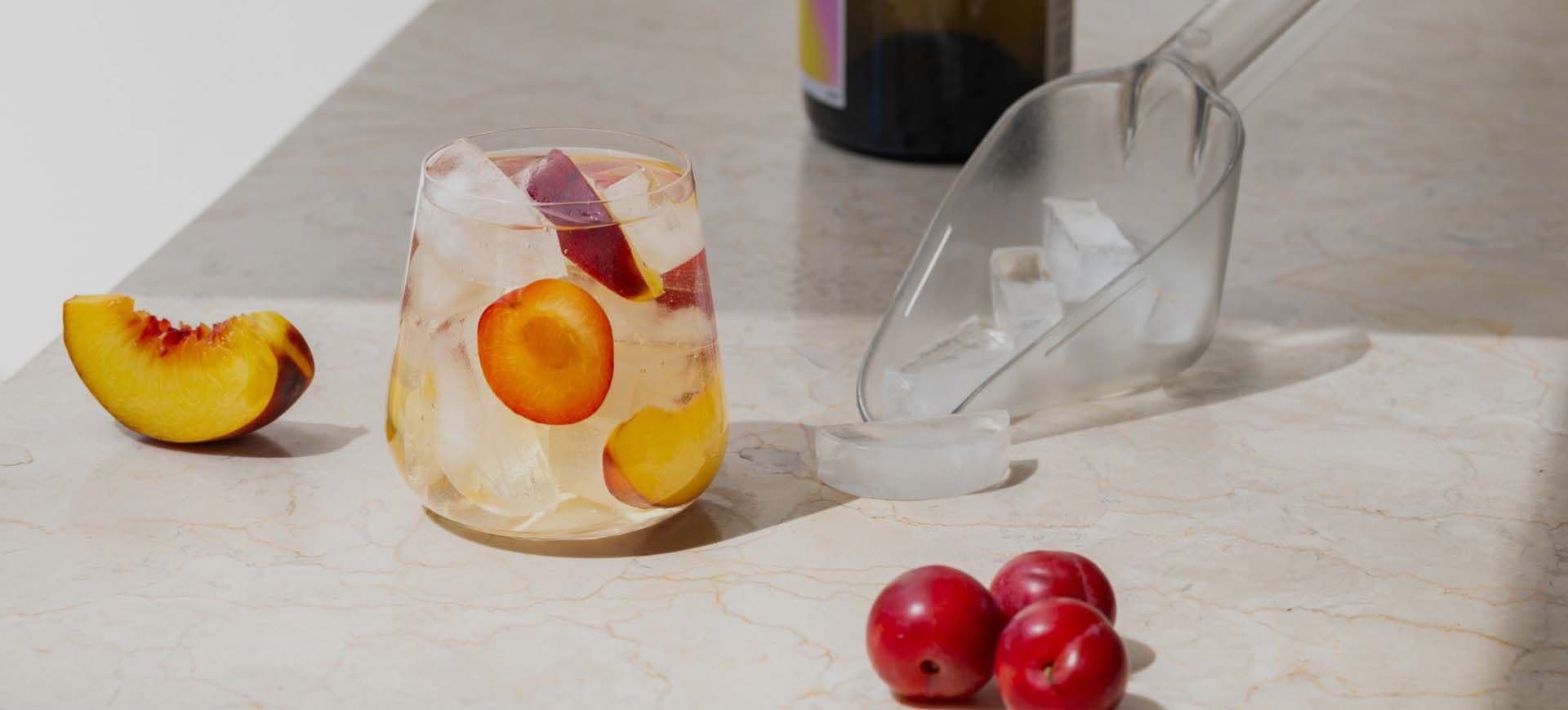 U-Line outdoor ice maker built into an outdoor kitchen island with a bucket of ice
